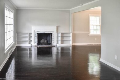 The living room features a beautiful fireplace.