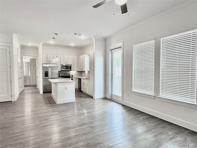 Large living room with faux wood floors