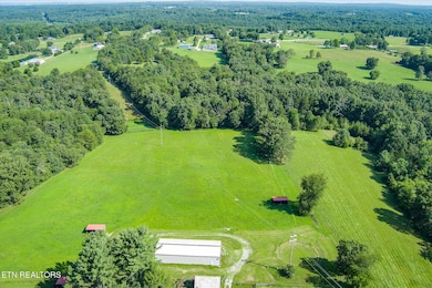 View of pasture, barn and woods