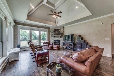 Look at that custom ceiling treatment! Living area