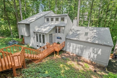 You don't have to sacrifice privacy and wooded views to reside in the trifecta of highly rated schools of excellence including coveted Walton High School