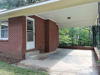 Carport with entry into Den.