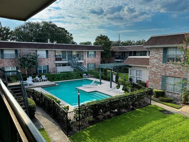 View of the pool and courtyard from unit's front door