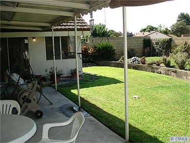 Large covered patio off family room with view of b
