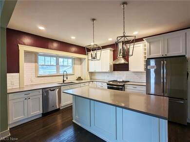 Kitchen with Custom Cabintry and Solid Surface Counters