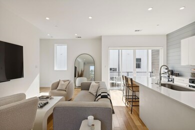 Living room featuring light hardwood / wood-style 