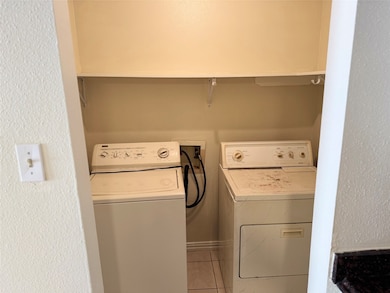 Laundry room conveniently located just off the kit