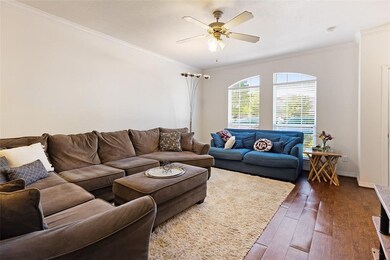 Spacious living room open to kitchen and dining, perfect for entertaining or relaxing.