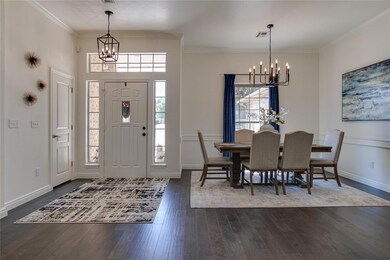 Entryway and formal dining area with new dark hard
