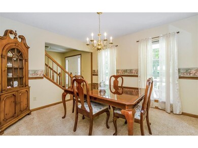 The formal dining room boasts plenty of room for t