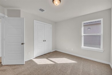 Unfurnished bedroom featuring a closet, visible v