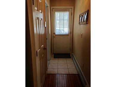 Entry. Convenient Side Entrance Is Greeted By Tile