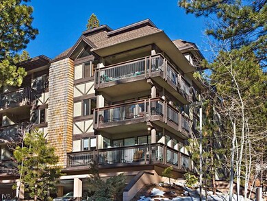 Exterior Back. Sunny, second floor end-unit with d