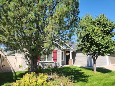 View of front of home featuring a gate,  and an attached garage