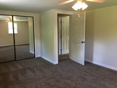 The master bedroom has lots of storage and new car
