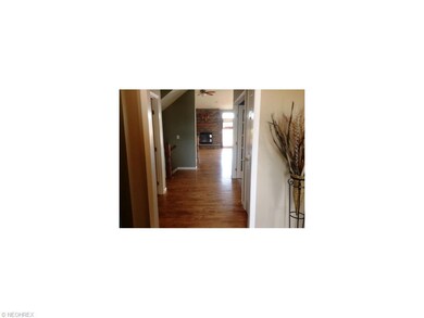 Foyer (9x8) features ceramic tile.  First floor be