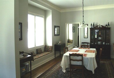 Large dining room with window seat.