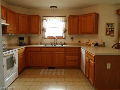 Another view of the large kitchen with plenty of c