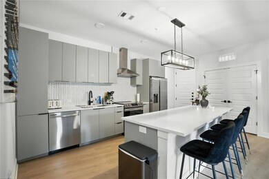 Kitchen featuring appliances with stainless steel