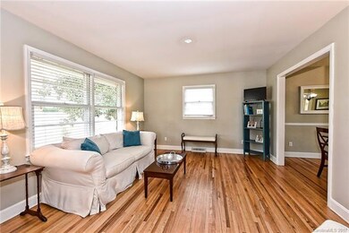 Family Room with Gorgeous Hardwood Floors, opens t