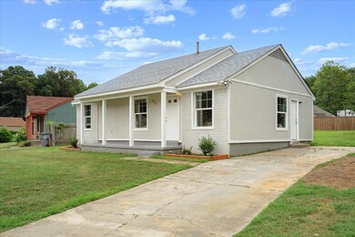 Single story home with a front lawn