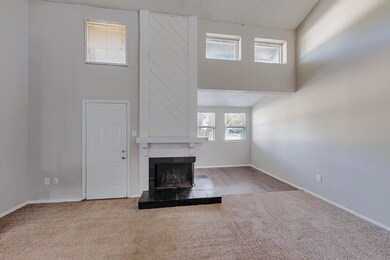 Unfurnished living room with a fireplace, a high c