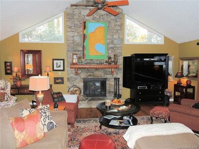 Livingroom with wood burning stone fireplace