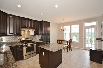 Large eat-in kitchen with granite surfaces and kit