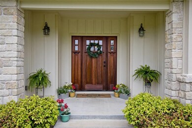 Large covered porch to welcome your guests and you