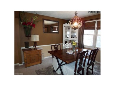 Dining room has built-in corner cupboard.