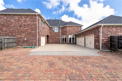 Professionally laid pavers have been added to effectively accommodate the weight of additional vehicles, but this area could also be used as a safe play space for children and pets.