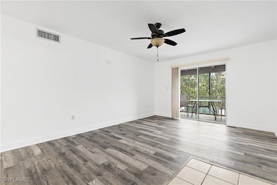 Unfurnished room featuring wood-type flooring and