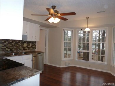 Tasteful counter tops...gorgeous laminate floors a