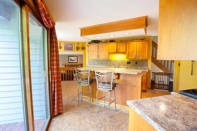 Sliding glass doors lead to large back two-tiered 