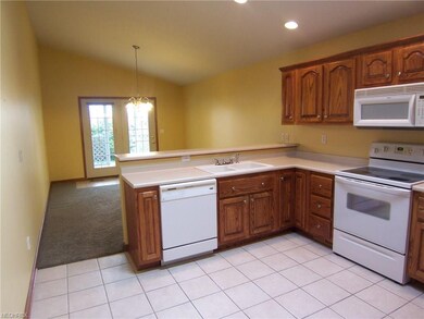 Another view of the kitchen and dining area.