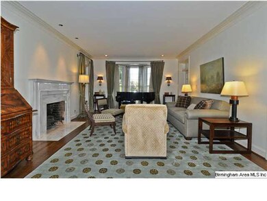 Living Room with bay window and marble fireplace