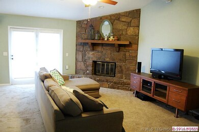 Lg. living room with fireplace.  Popcorn ceiling t