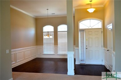 Formal dining with beautiful wainscotting, crown m