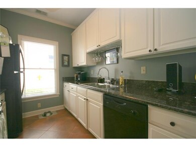 Nice size kitchen with tile floors and good cabine