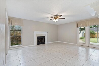 Second family room with fireplace and access to ba