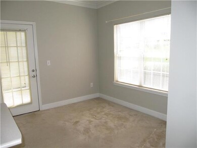 Large dining area w/door to patio.
