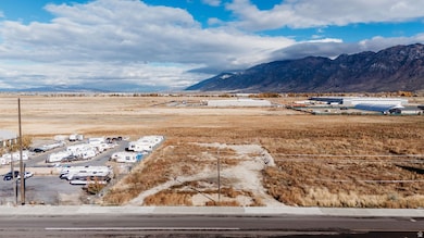 View of mountain backdrop with industrial structures