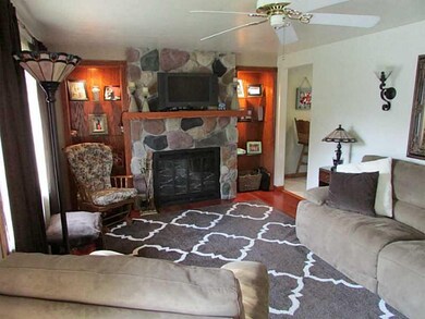 Living Room. Stone fireplace in the living room wi