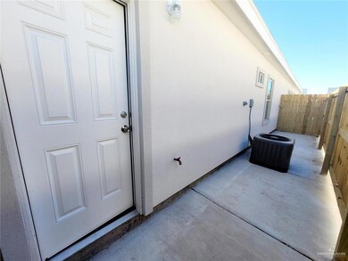 Doorway to property featuring a patio