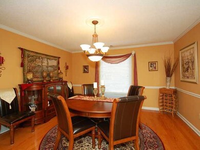 Dining room features gleaming hardwood floors