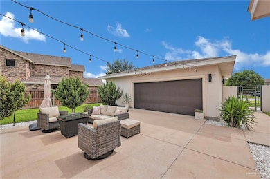 Garage featuring driveway