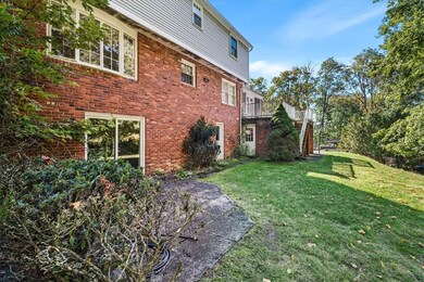 Another view of the rear of the home with slider d