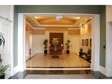 Elegant lobby with marble floors and cove lighting