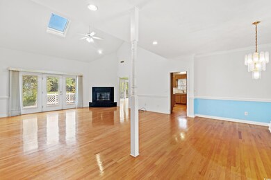 Unfurnished living room featuring light hardwood /