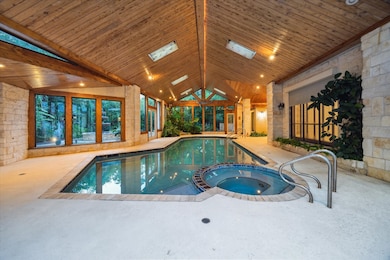 Another view of the pool / hot tub area with direc